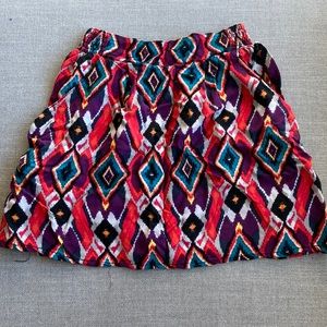 Material Girl colourful skirt with pockets in size S.